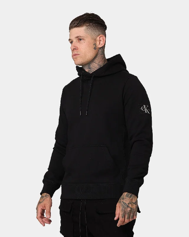 Calvin Klein Monogram Sleeve Badge Hoodie Black Hoodie with Elastic Cuffs Stretchable Comfortable Calvin Klein Monogram Sleeve Badge Hoodie Black Hoodie with Elastic Cuffs Stretchable Comfortable